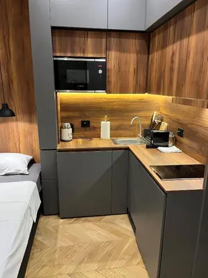 a small kitchen with a sink and a microwave at Riverside Heritage Lux and Modern in Sajmište