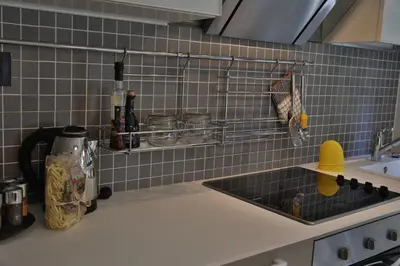 a kitchen with a sink and a counter top at Palace Apartment City Center in Belgrade