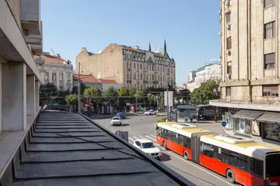 a view of a city street with buses and cars at Simma Luxury Apartments & Rooms in Belgrade