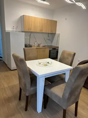 a white table and chairs in a kitchen at Popovic in Ub