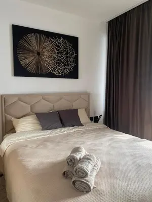 a bedroom with a bed with towels on it at Kosmaj Renew - Sunset View in Koraćica