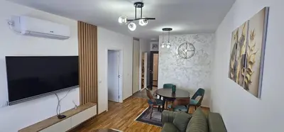 a living room with a couch and a table at Apartman Lukač in Belgrade