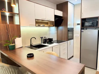 a kitchen with a wooden counter top and a refrigerator at Cetinjska Palace in Belgrade