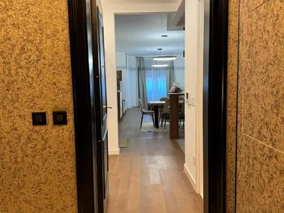 an open door to a hallway with a dining room at Cetinjska Palace in Belgrade