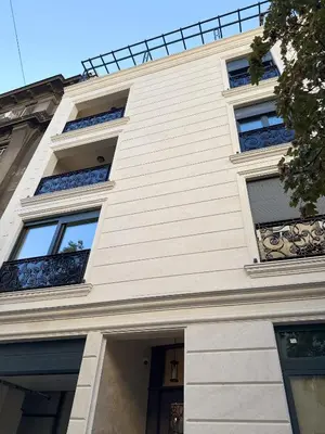 a white building with windows and a door at Cetinjska Palace in Belgrade