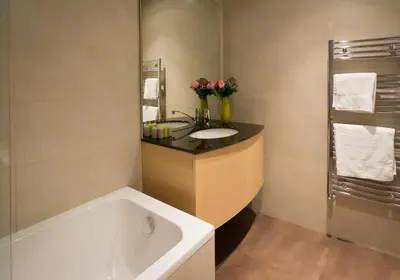 a bathroom with a sink and a bath tub at Apartment Mercedes in Belgrade