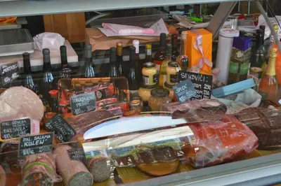 a display case in a store filled with lots of food at Apartment Mercedes in Belgrade