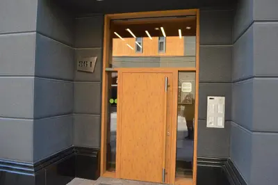 a door in a building with a sign on it at Apartment Mercedes in Belgrade