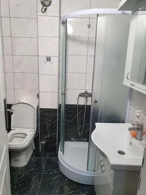 a bathroom with a shower and a toilet and a sink at Small cute single room A2 in Pancevo in Pančevo