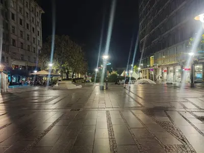 a city street at night with buildings and lights at Prime City Center Apartment - Walk to All Attractions in Belgrade