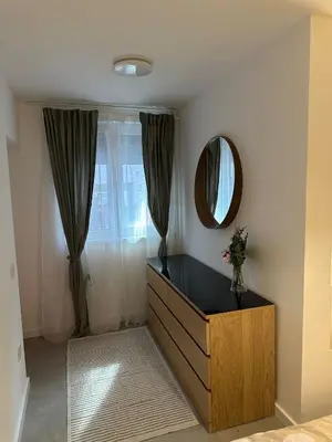 a dressing room with a dresser and a mirror at Apartman Dorćol VS60 in Belgrade