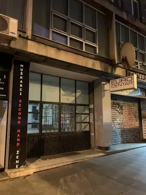 an entrance to a building with a sign on it at All you need is just around the corner in Belgrade