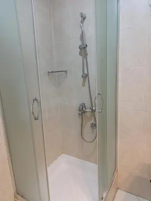 a shower with a glass door in a bathroom at Moka in Belgrade