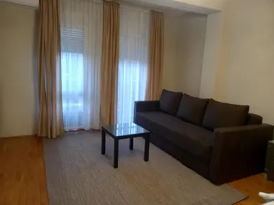 a living room with a couch and a coffee table at Moka in Belgrade