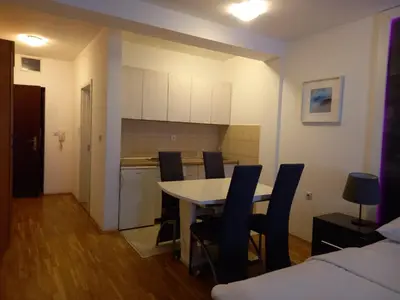 a kitchen and dining room with a table and chairs at Kiki in Belgrade