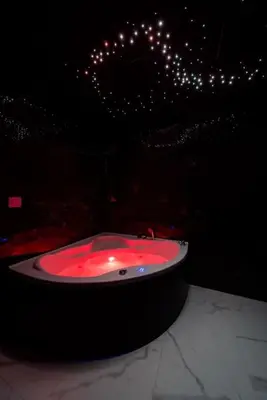 a red sink in a room with lights at Dark Nest 3 Belgrade Apartments in Zvezdara