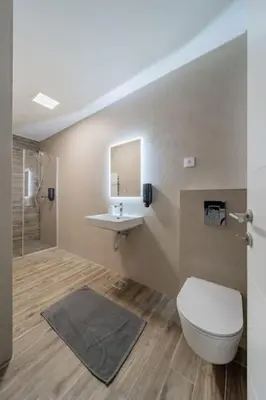 a bathroom with a toilet and a sink at Dark Nest 3 Belgrade Apartments in Zvezdara