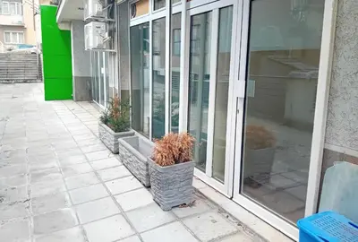 two potted plants sitting in front of a window at Apartman Dimitrijala 52 in Zvezdara