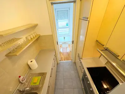 a small kitchen with a sink and a window at Apartment B5 in Belgrade