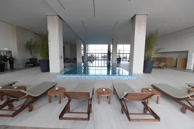a lobby with tables and chairs in a building at Exquisite BW Residences 210sqm condo in Sajmište
