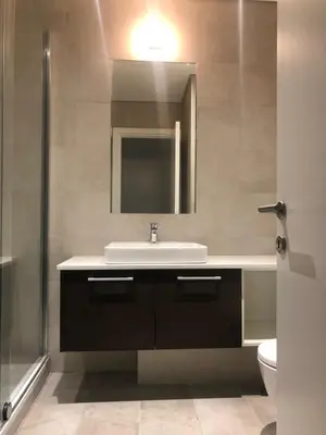 a bathroom with a sink and a mirror at Exquisite BW Residences 210sqm condo in Sajmište