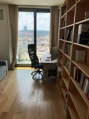 an office with a desk and a chair and a window at Exquisite BW Residences 210sqm condo in Sajmište