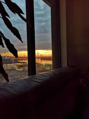 a bedroom with a window looking out at the sunset at Exquisite BW Residences 210sqm condo in Sajmište