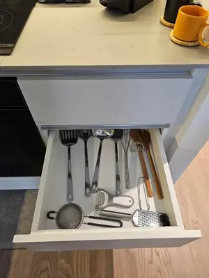 a kitchen drawer filled with lots of utensils at ALPHA LUX - Galerija mall view - Beograd na vodi in Belgrade