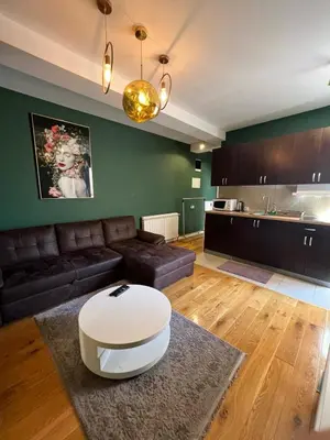a living room with a couch and a table at Apartment A2, Center, Belgrade in Belgrade