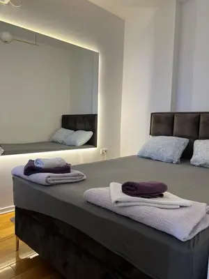 a bedroom with two beds with towels on them at Apartment A2, Center, Belgrade in Belgrade