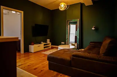 a living room with a couch and a television at Apartment A2, Center, Belgrade in Belgrade