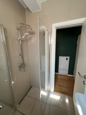 a bathroom with a glass shower and a sink at Apartment A2, Center, Belgrade in Belgrade