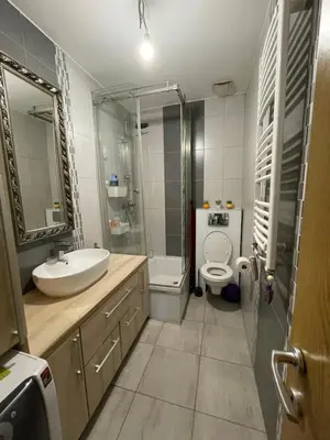 a bathroom with a sink and a toilet and a shower at Comfy & Cozy Apartment - parking in Karaburma