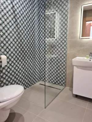 a bathroom with a toilet and a glass shower at Fera in Belgrade