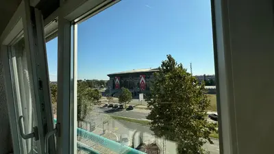 a view of a building from a window at Arena BGD - Hadrianz Apartment in Novi Beograd