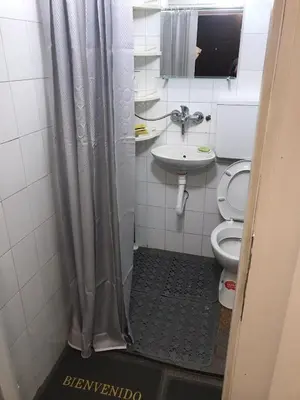 a bathroom with a shower and a toilet and a sink at Near Highway free parking apartment in Rakovica
