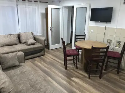 a living room with a couch and a table at Near Highway free parking apartment in Rakovica