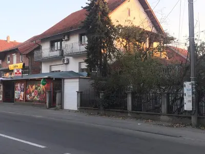 a building on the side of a street at Near Highway free parking apartment in Rakovica