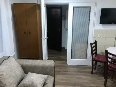 a living room with a couch and a table at Near Highway free parking apartment in Rakovica