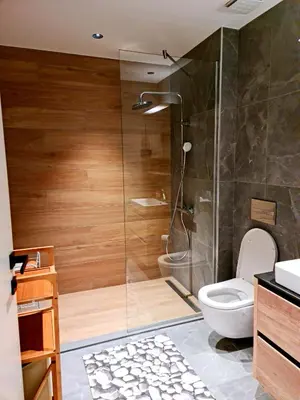 a bathroom with a shower and a toilet at Delux Simfonija Belgrade Waterfront in Sajmište
