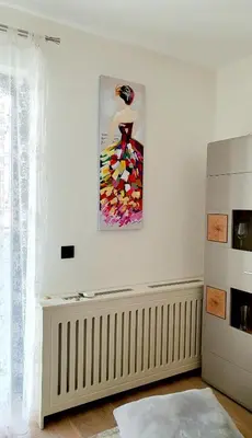 a white room with a painting on the wall at Delux Simfonija Belgrade Waterfront in Sajmište