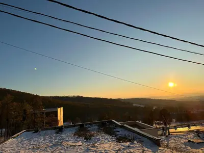a view of the sunset from the roof of a house at Apartman Kosmajska Vila in Rogača