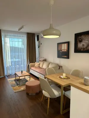 a living room with a couch and a table at Apartman Kosmajska Vila in Rogača