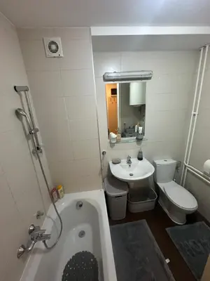 a bathroom with a tub and a toilet and a sink at Akacija - Belvil in Belgrade
