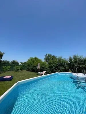 a swimming pool in a yard with at Lokal za zurke, slavlja i rodjendane in Pećinci