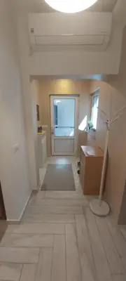 an empty room with a desk and a lamp on the floor at Appartement Darvinova in Voždovac