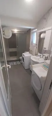 a bathroom with a toilet and a sink at Appartement Darvinova in Voždovac