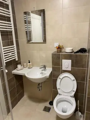 a bathroom with a toilet and a sink at Green Residence in Belgrade