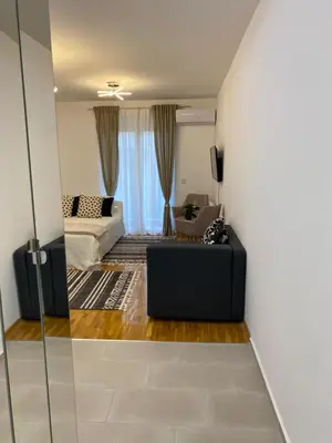 a living room with a couch and a table at Green Residence in Belgrade