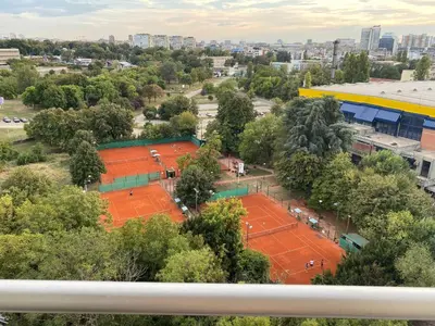 an overhead view of two tennis courts in a city at Green Residence in Belgrade